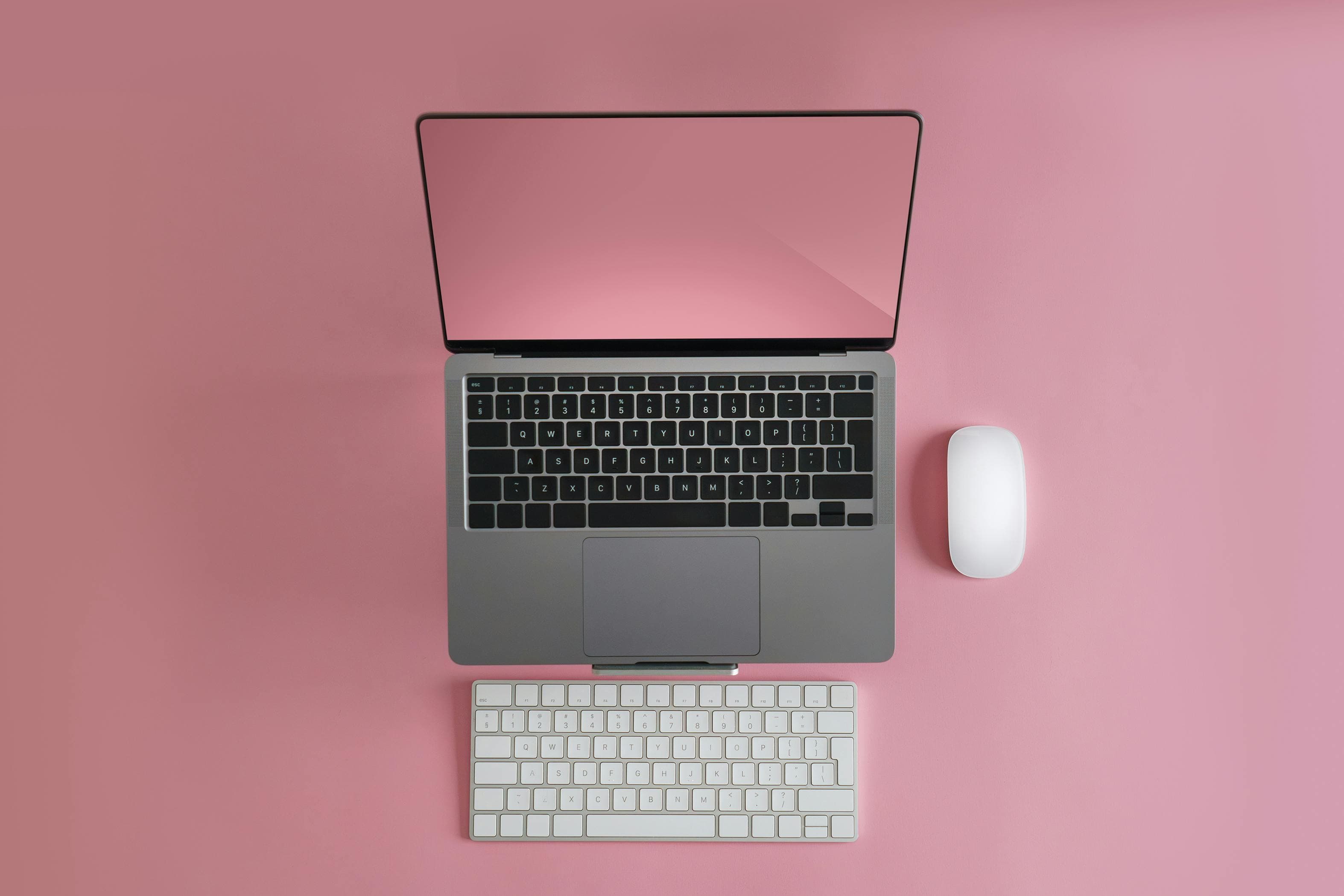 Person working at desk with multiple screens